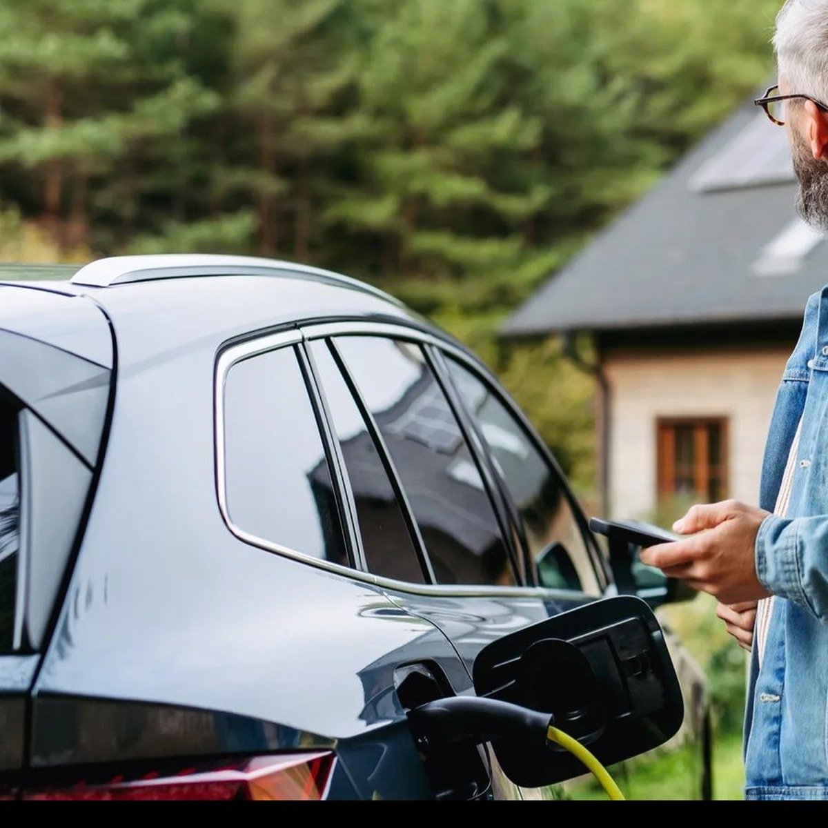 UK EV charging cable plugged into electric car