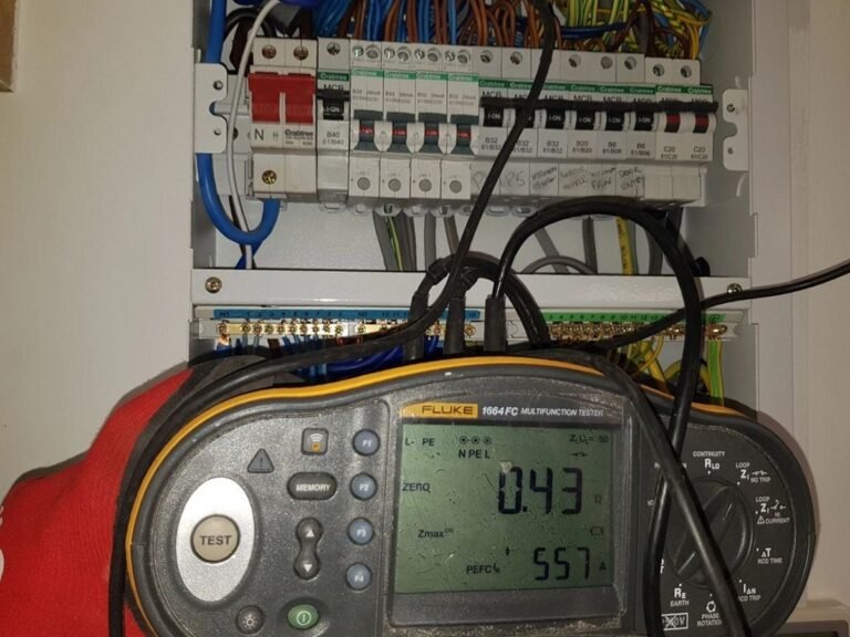 Fluke multifunction tester connected to a Crabtree consumer unit during an EICR