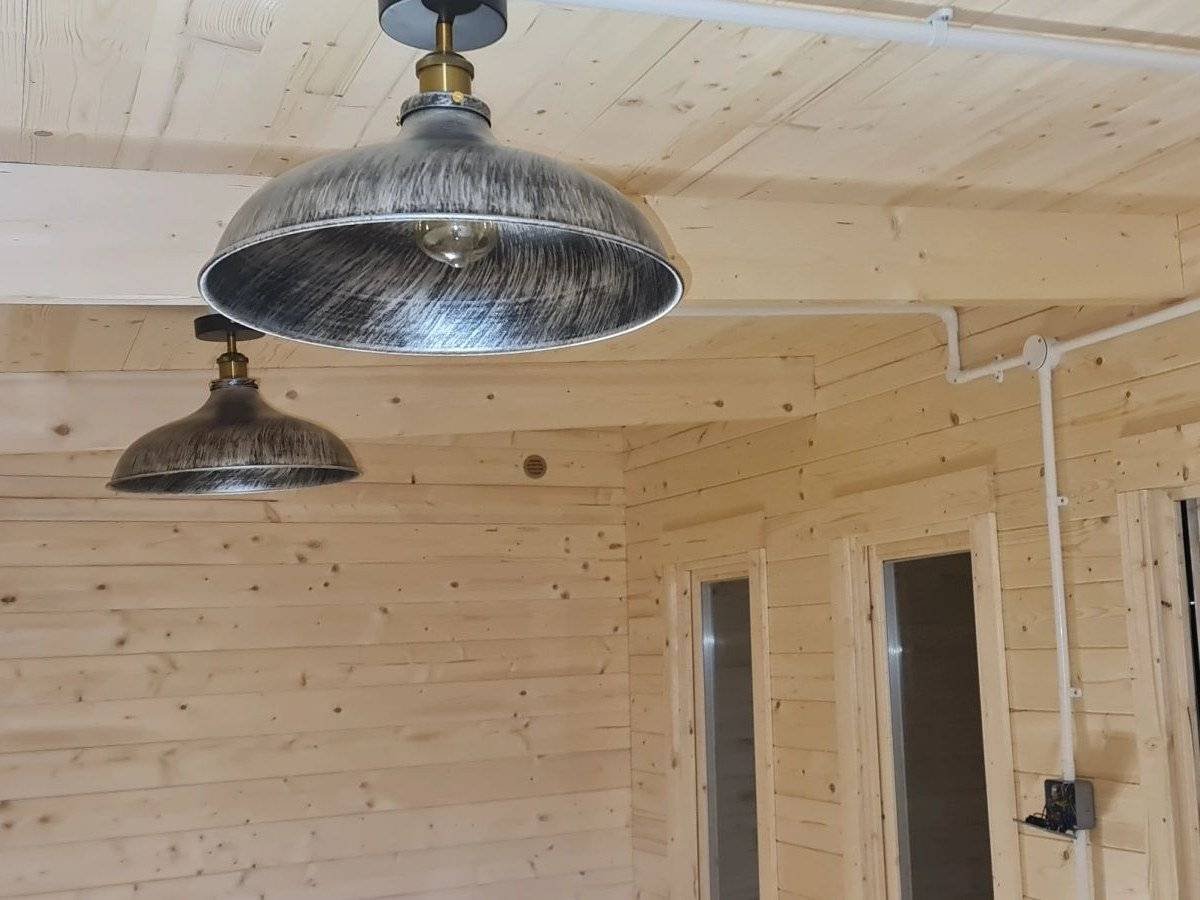 Garden office electrical install with conduit and pendant light